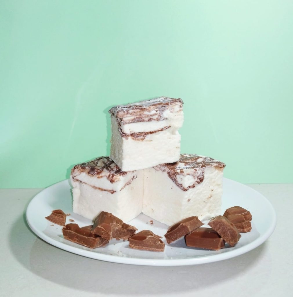 Marshmallows with chocolate chunks on a plate
