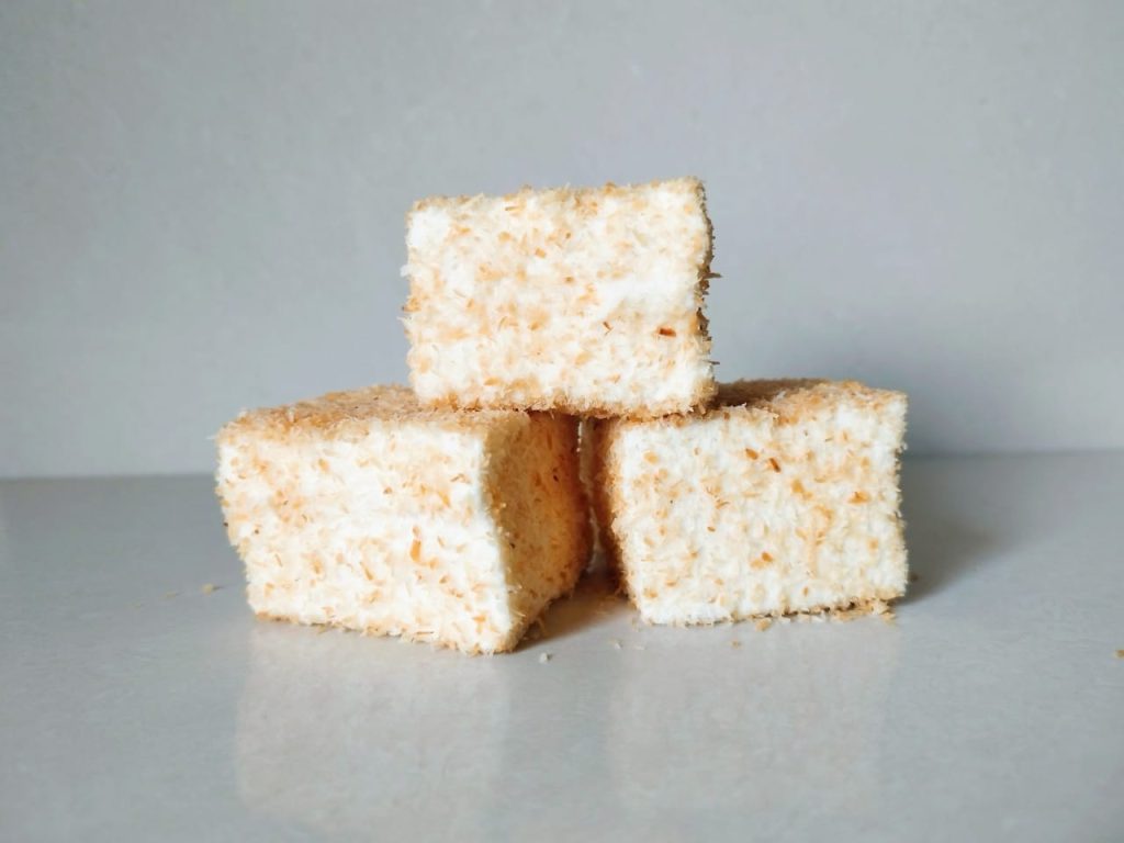 Marshmallows rolled in toasted coconut